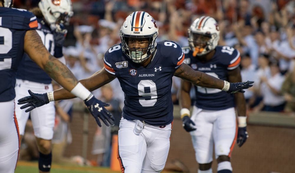 <p>Kam Martin (9) celebrates after scoring a touchdown during Auburn vs. Kent State, on Saturday, Sept. 14, 2019, in Auburn, Ala.</p>