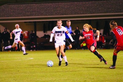 Senior midfielder Katy Frierson keeps the ball from Georgia's Susannah Dennis and Jamie Pollock. (Alex Sager / ASSOCIATE PHOTO EDITOR)