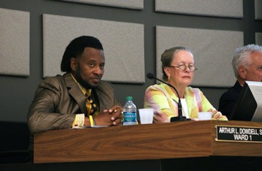 Councilmen Arthur Dowdell and Sheila Eckman listen during last night's meeting. (Courtesy of Rebecca Croomes)