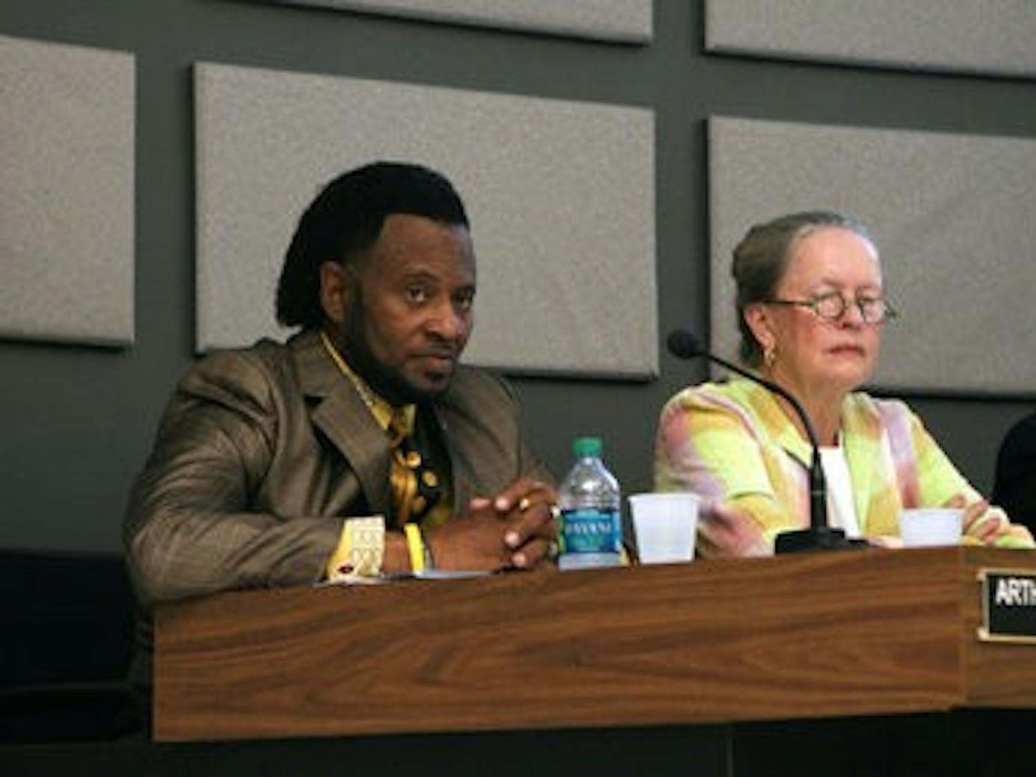 Councilmen Arthur Dowdell and Sheila Eckman listen during last night's meeting. (Courtesy of Rebecca Croomes)