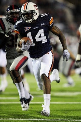 Demond Washington returns an Ole Miss kickoff back for a toughdown in the first half. (Todd Van Emst / Auburn media relations)