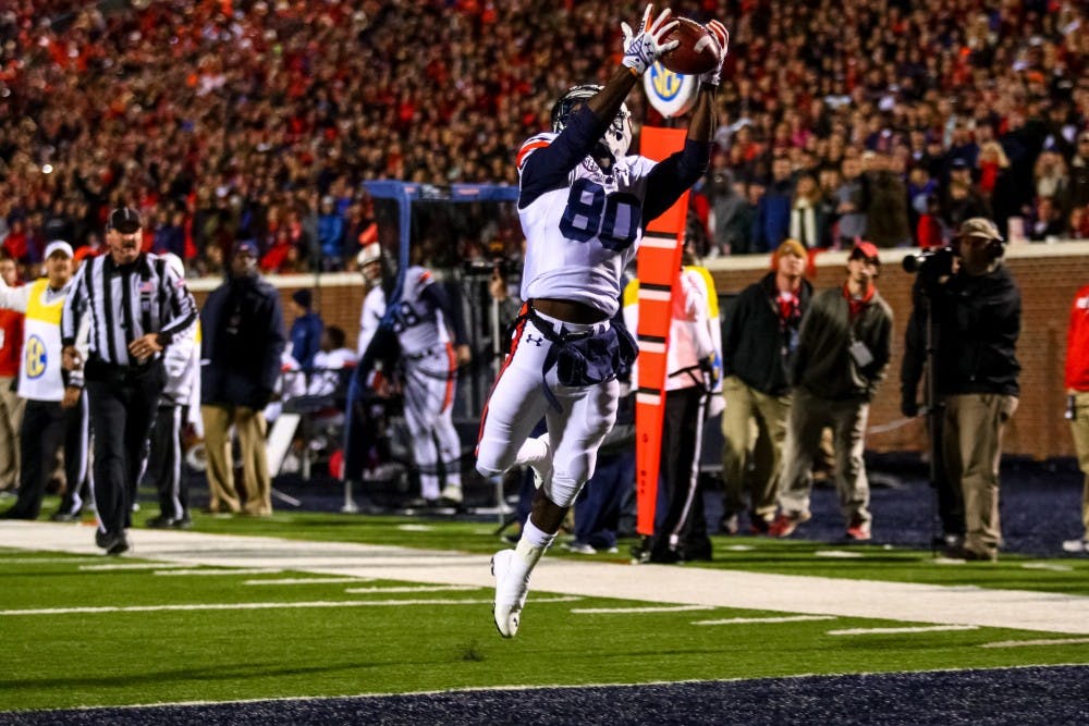 Marcus Davis makes a spectacular catch as he falls into the end zone. (Kenny Moss | Photographer)