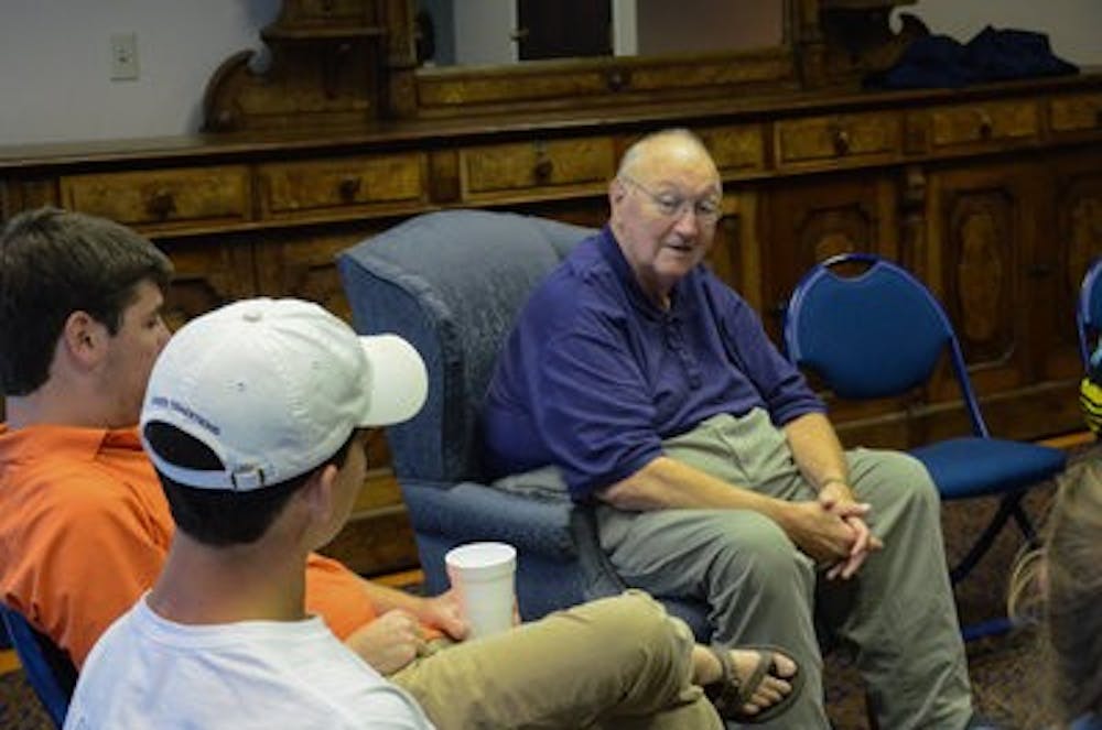 David Housel discusses a book with students in his book club.