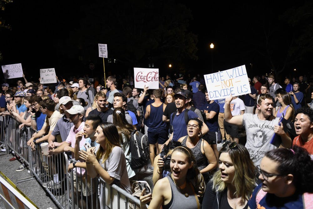 Auburn students congregate on Thach Avenue near Foy Hall after alt-right leader Richard Spencer's talk on Tuesday, April 18, 2017 in Auburn, Ala. 