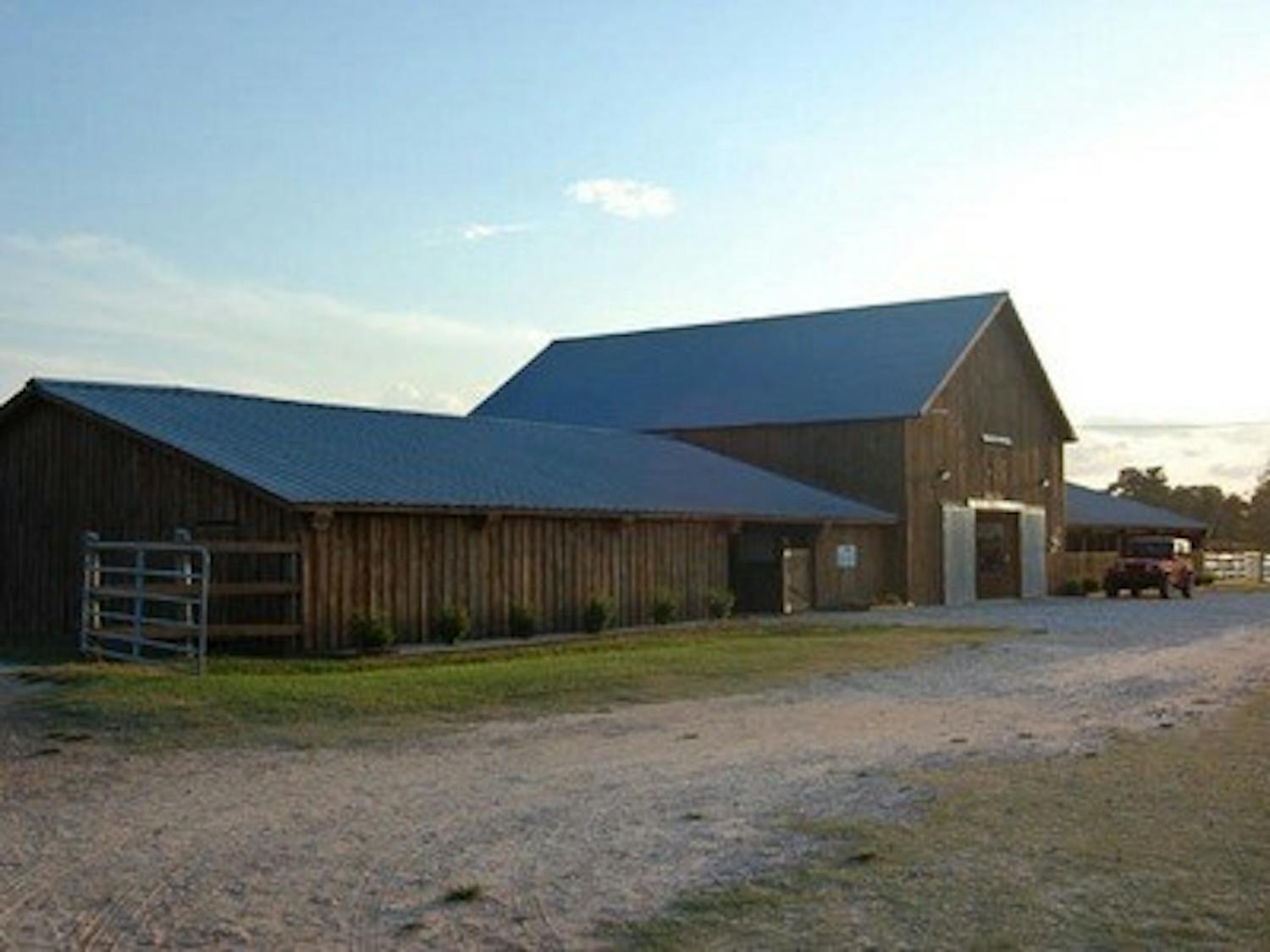 Although practice starts at noon, the athletes usually don't leave until after the sky above the barn has gone dusky.