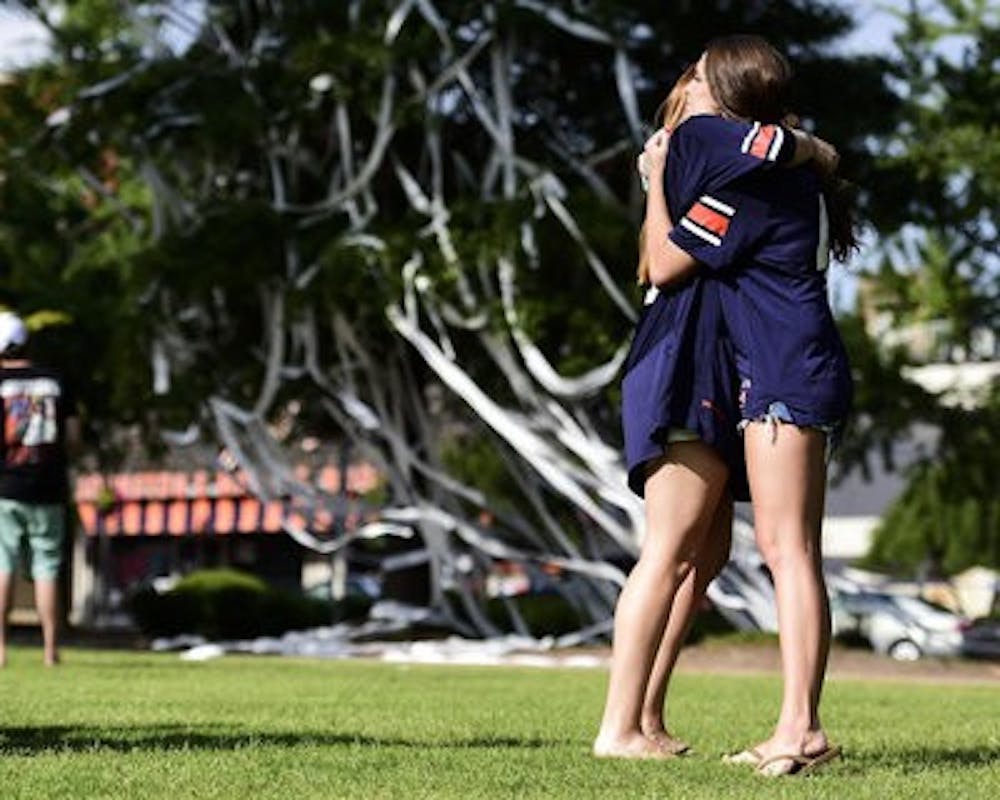 Students in No. 43 jerseys roll Toomer's Corner in memory of Philip Lutzenkirchen. (Contributed by Zach Bland)