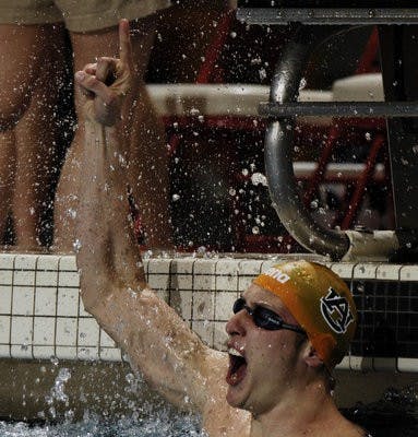 Auburn's Gideon Louw celebrates winning the 50 yard freestyle Thursday night.SEC Swimming and Diving Championships in Athens, GA.,  on Thursday, Feb. 18, 2010. FINALS, day 2Todd Van Emst