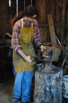 Shachar Newton displays his blacksmithing to onlookers Saturday. (Charlie Timberlake / Assistant Photo Editor)