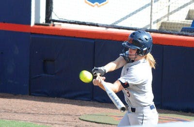 Freshman first baseman Morgan Estell bunts the ball. (Christen Harned / Assistant Photo Editor)