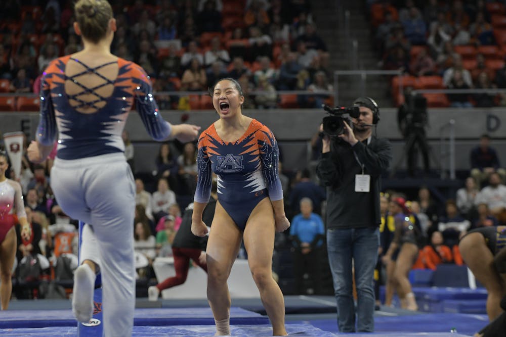 <p>Sophia Groth celebrating her beam routine at Quad Meet in Neville Arena on February 2nd 2024</p>