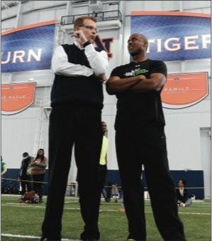 Gus Malzahn talks to Jeff Blake Tuesday, March 5 at Auburn NFL
Pro Day. (Courtesy of Todd Van Emst / AUBURN ATHLETICS PHOTOGRAPHER)