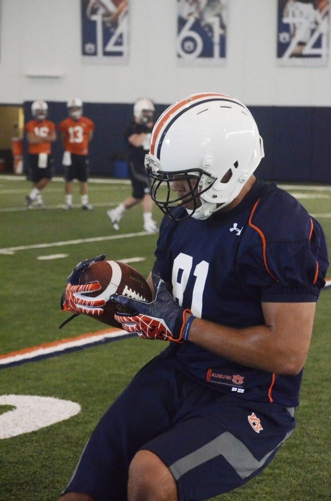 C.J. Uzomah catching a pass thrown by Nick Marshall.Sarah May/ ASSISTANT PHOTO EDITOR