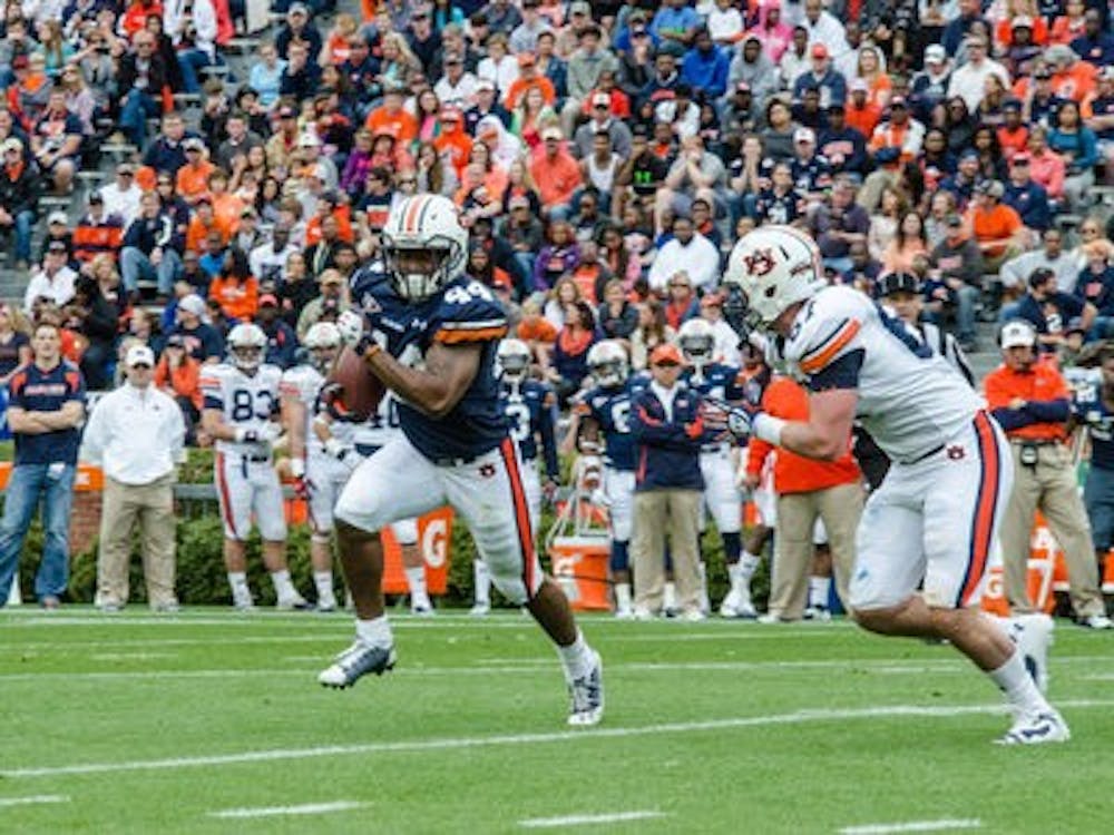 Running back Cameron Artis-Payne carries the ball during Saturday's A-Day game at Jordan-Hare Stadium.