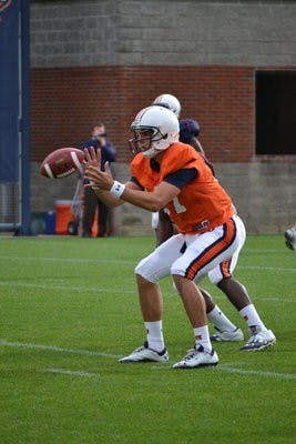 Sophomore quarterback Ben Durand catches a snap. (Raye May / PHOTO EDITOR)