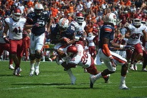 Mike Blakely, running back, brought down by Rohan Gaines of Arkansas. (Danielle Lowe / ASSISTANT PHOTO EDITOR)