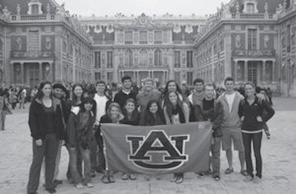 Last year's group visited the Vatican and listened to the Pope. Here they are seen outside Versailles. (Courtesy of the Auburn Alumni Association)