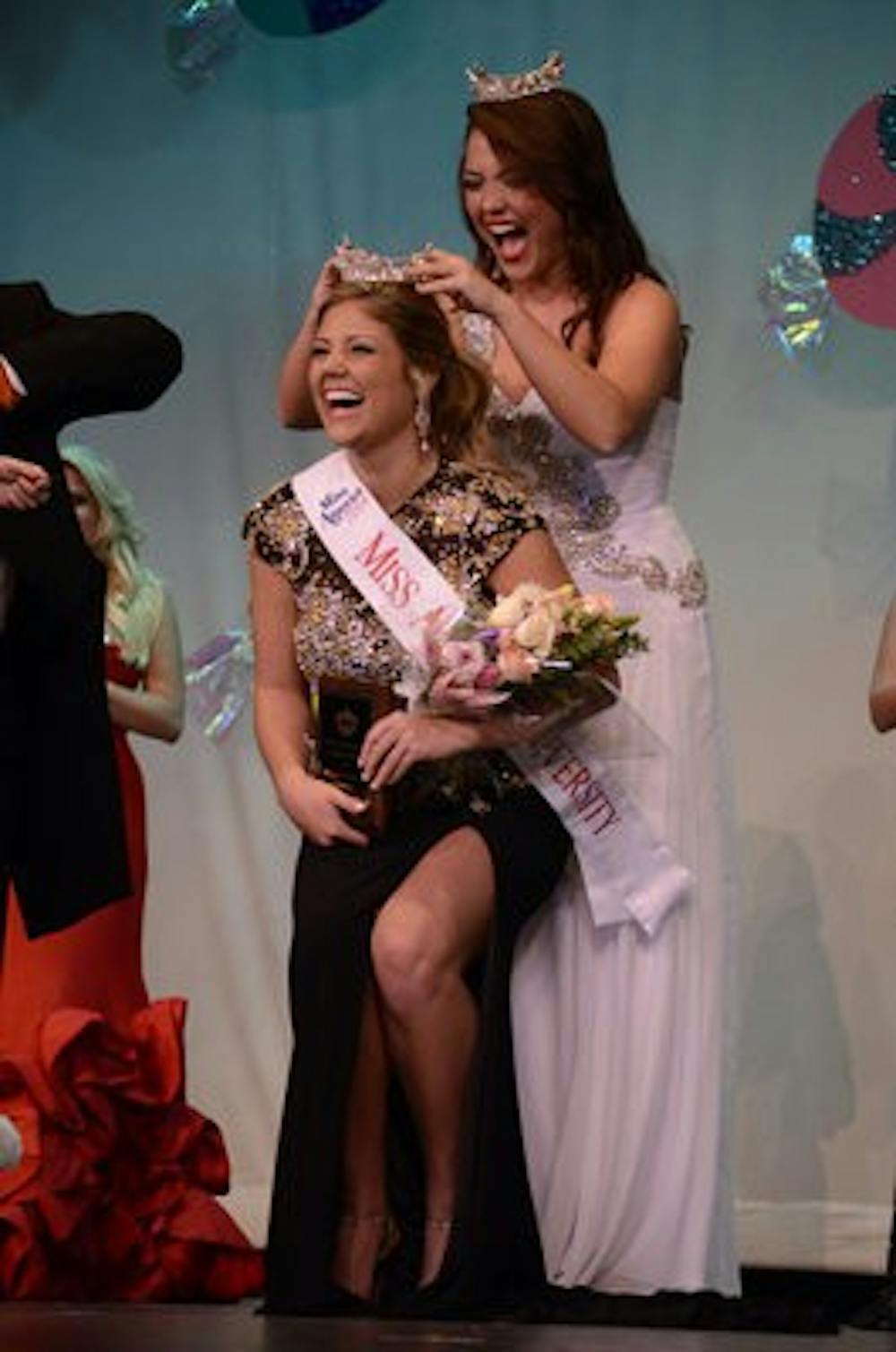 Meg McGuffin is crowned Miss Auburn University by 2013 Miss Auburn University Holland Brown (Sarah May / Assistant Photo Editor)