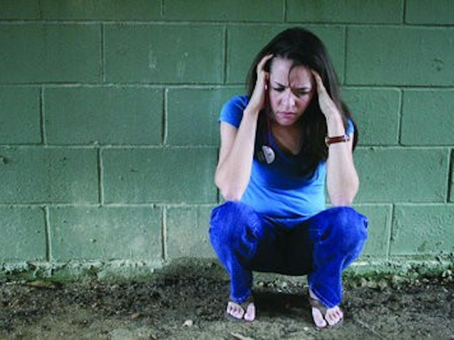 Kayla Burke begins to crack under the pressure of graduate school classes. (Emily Adams/ PHOTO EDITOR)