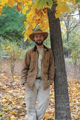 Standing next to a hickory tree, Patrick Thompson pauses to take in the sights and sounds of the Donald E. David Arboretum. (Maria Iampietro / Associate Photo Editor)