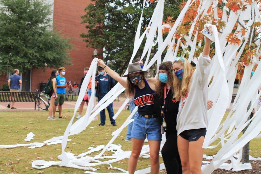 Auburn students pose for a picture after rolling Toomer's Corner on Nov. 7, 2020. 