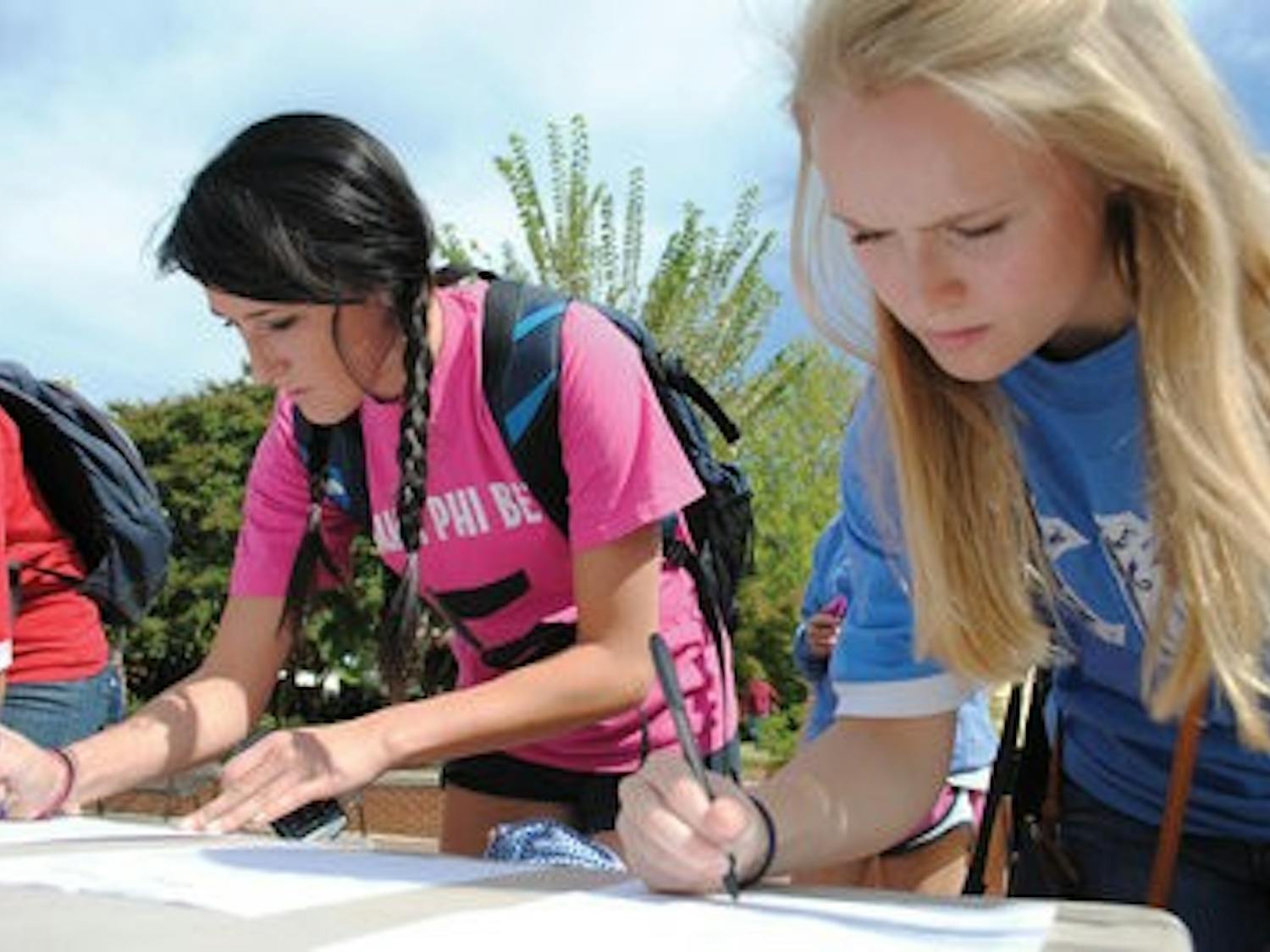 Greek organization members sign in on the concourse, wearing their letters for spirit points. Different events throughout the week gave Greeks the chance for a little friendly competition. (Maria Iampietro / Associate Photo Editor)