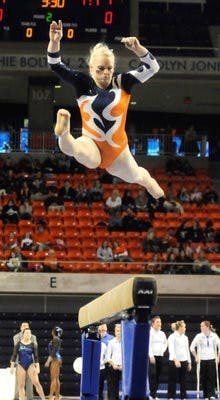 Kylie Shields preforms on beam during Friday's meet against Kentucky. (Todd Van Emst / Auburn Media Relations)