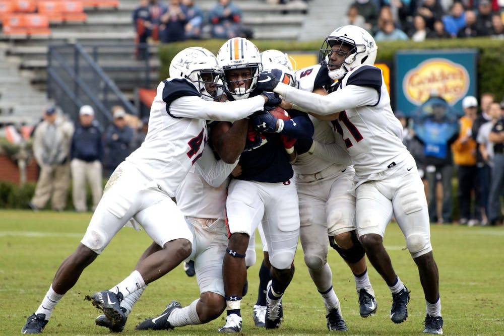 Marquis McClain (17) resists tackle by multiple Samford players during the Auburn vs. Samford football game on Nov. 23, 2019 in Auburn, AL.