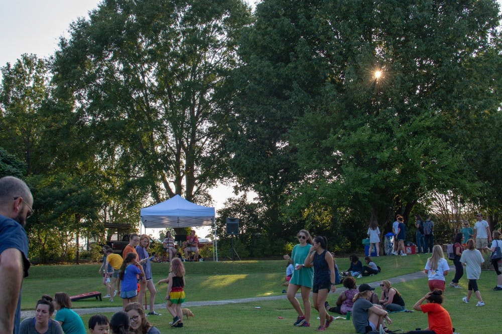 <p>Members of the public enjoy the evening taking part in the Sustainability Picnic at Donald E. Davis Arboretum on Wednesday, Aug. 22, 2018, in Auburn, Ala.</p>
