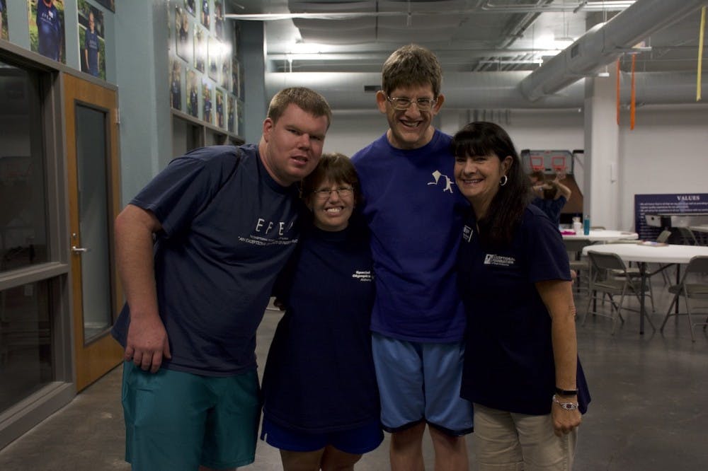 <p>Athletes Dillon Smith, Denise Andreadis and Jeffrey Barns pose with Coach Dana Stewart at the Exceptional Foundation Wednesday, June 20, 2018 in Auburn, Ala.</p>
