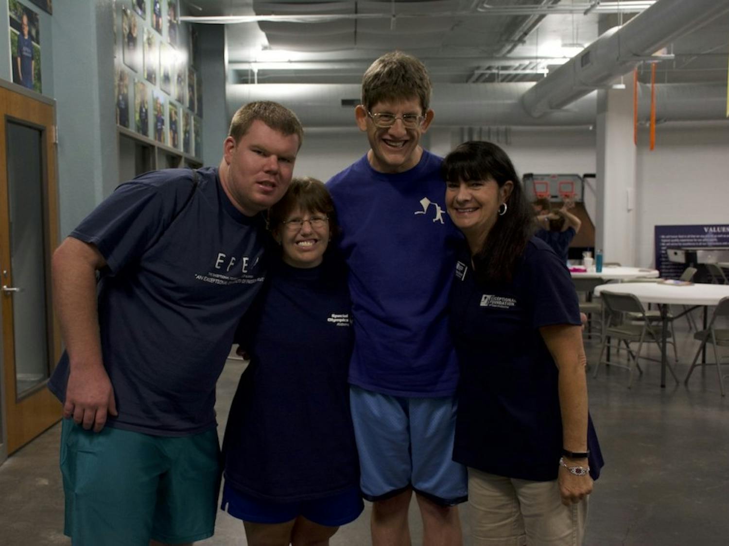 Athletes Dillon Smith, Denise Andreadis and Jeffrey Barns pose with Coach Dana Stewart at the Exceptional Foundation Wednesday, June 20, 2018 in Auburn, Ala.