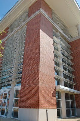 "Light shelves" on the exterior of the Miller Gorrie Building Science Center demonstrate one way the building strives for sustainability. The shelves help refract a maximum amount of light into the building and regulate the amount of heat entering the building. (Rebekah Weaver / Assistant Photo Editor)