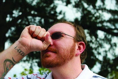 In Japan, arrogant people are referred to as big-nosed rather than big-headed, and the accusation is represented by holding a closed fist in front of one's nose. Two fists can emphasize this gesture. (Rebecca Croomes / PHOTO EDITOR)