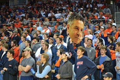 Students hold up a cutout during Pearl's introductory press conference March 18.