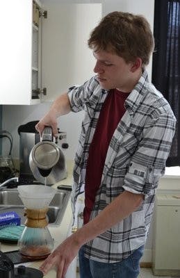 Clement has been making coffee on his own since he was a junior in high school. He has over 20 customers. (Raye May / PHOTO EDITOR)