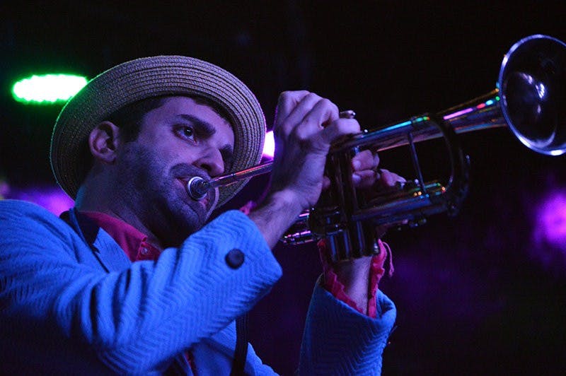 K.C. O'Rorke plays trumpet during Flow Tribe's performance at Bourbon in Auburn, AL on Jan 16, 2015. Emily Enfinger | PHOTO EDITOR