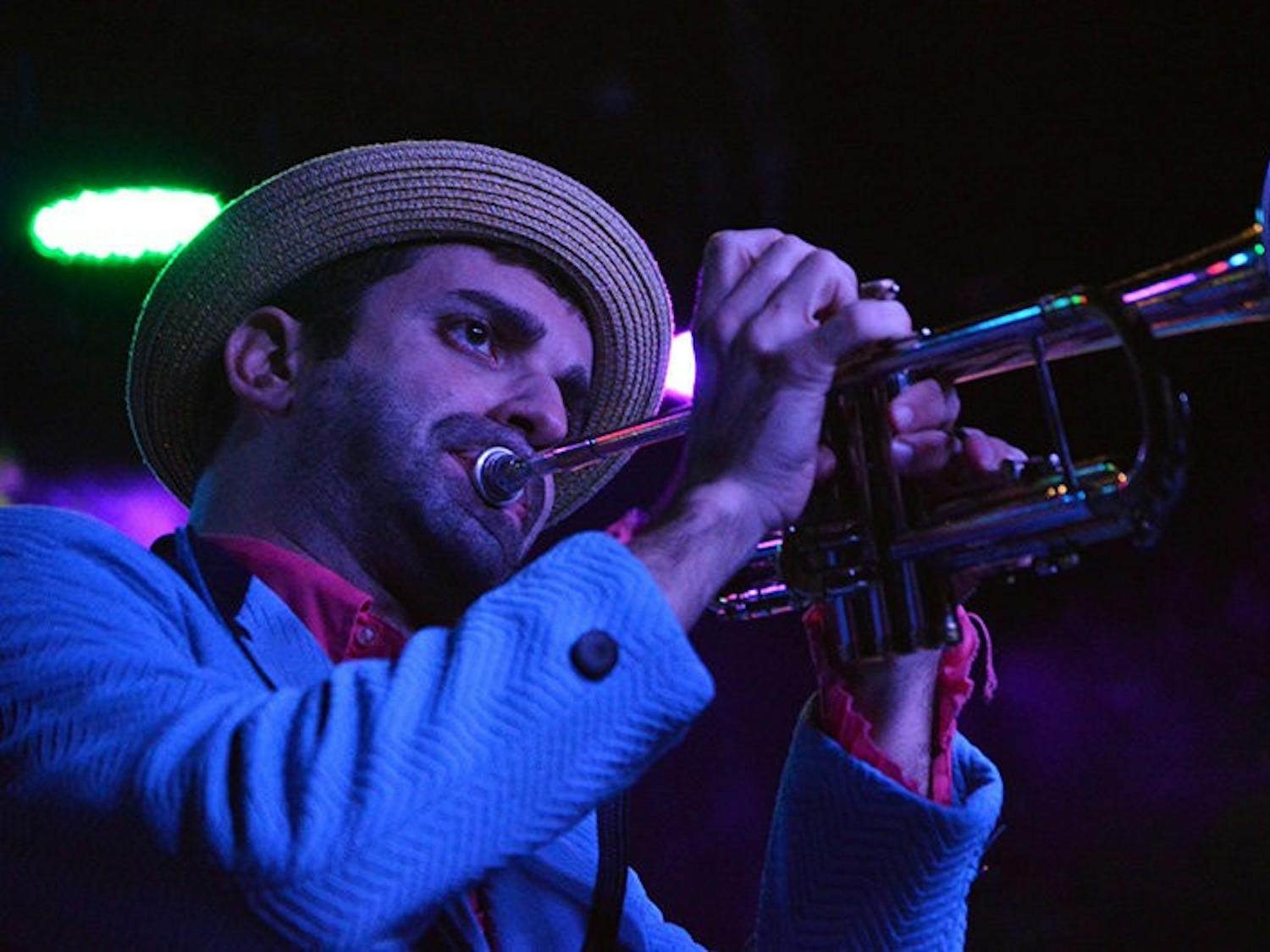K.C. O'Rorke plays trumpet during Flow Tribe's performance at Bourbon in Auburn, AL on Jan 16, 2015. Emily Enfinger | PHOTO EDITOR