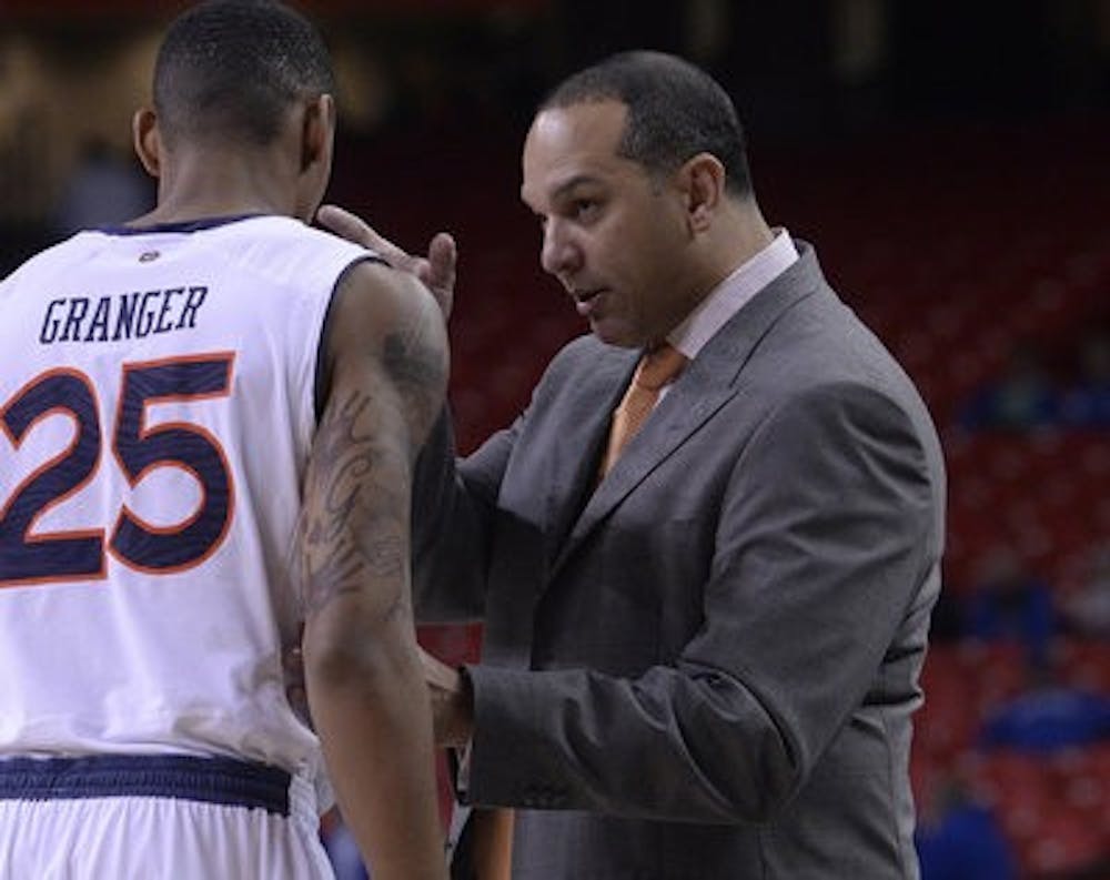 Auburn men's basketball coach Tony Barbee talks to Jordon Granger during the Tigers' loss to South Carolina in the SEC Tournament.
