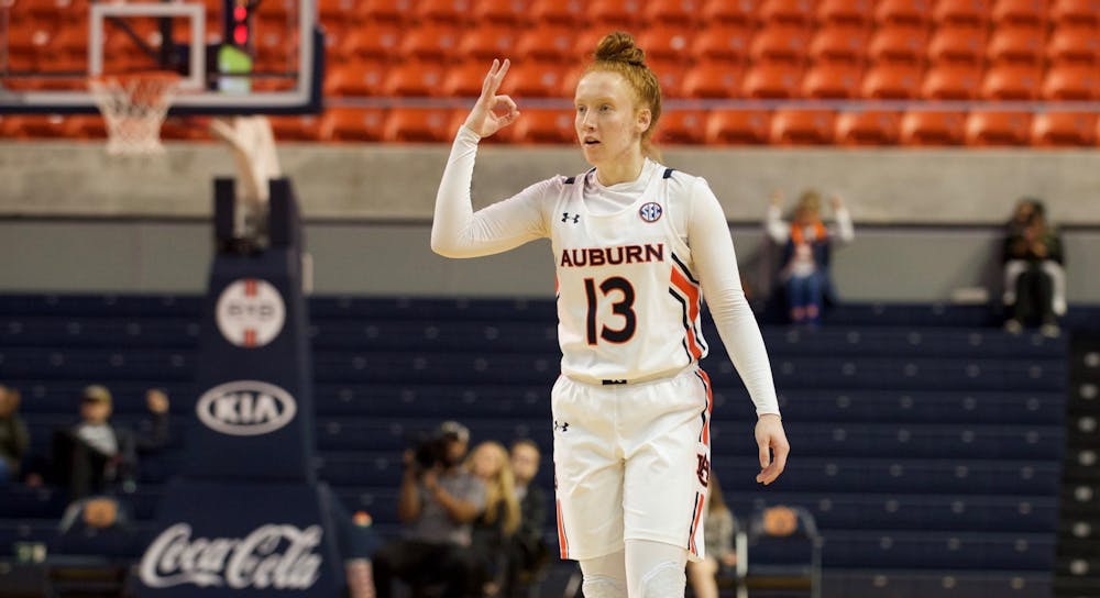 <p>Lauren Hansen (13) celebrates making a 3-pointer in Auburn Women's Basketball vs. Mississippi State on Feb. 20, 2020 in Auburn, AL</p>