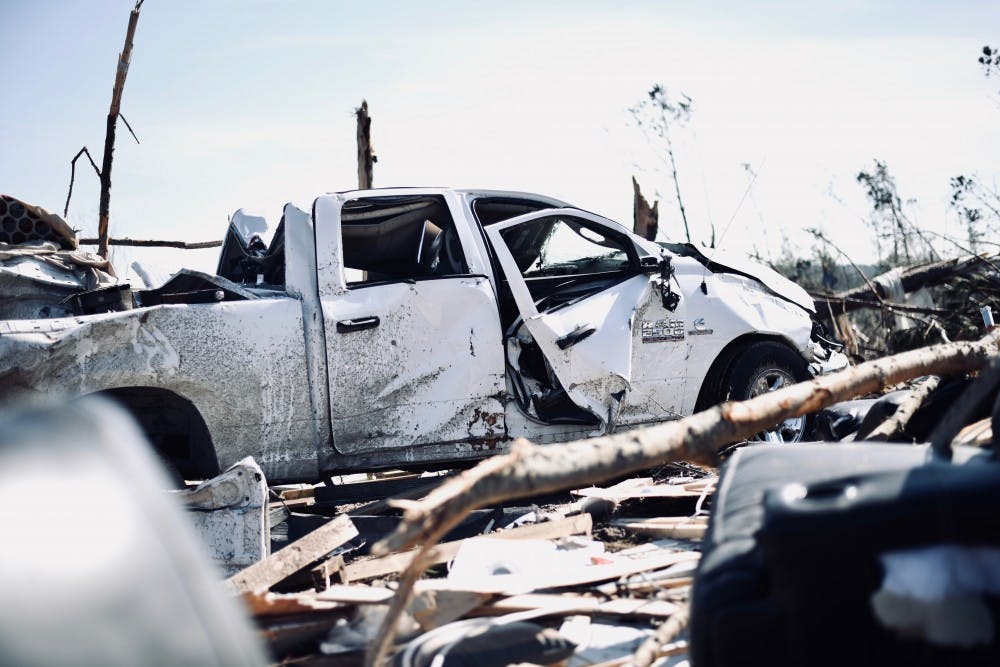 A white truck sits on top of remains of homes on Thursday, March 7, 2019 in Beauregard, Ala.