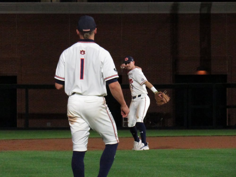 <p>Cole Foster (7) throws the ball to Blake Rambusch (1) during an inning change on March 2, 2022 at Plainsman Park in Auburn, Ala.</p>