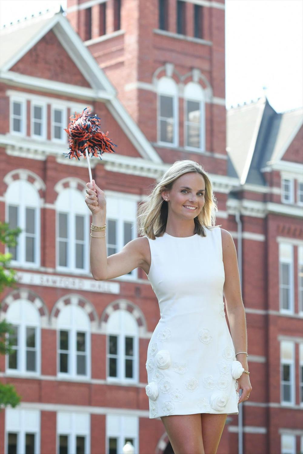 <p>Lainey Anderson holding an Auburn University shaker in front of Samford Hall for her graduation photographs during the spring of 2025. Contributed by Jadie Whisenhunt.</p>