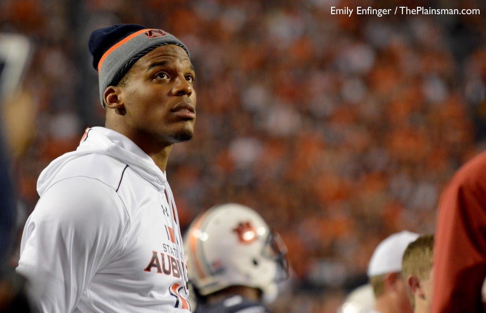Cam Newton, Carolina Panthers quarterback and former Auburn quarterback, watches the videoboard for a replay during the second half. Alabama vs Auburn on Nov. 28. (File photo)