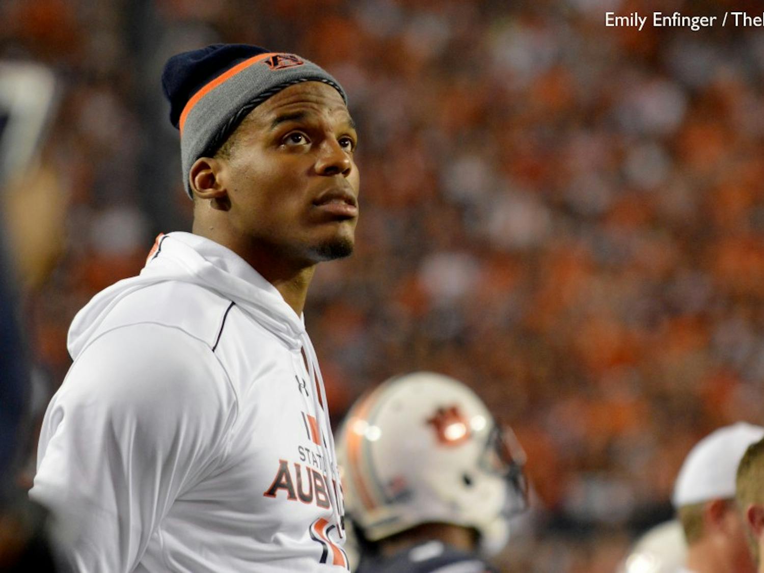 Cam Newton, Carolina Panthers quarterback and former Auburn quarterback, watches the videoboard for a replay during the second half. Alabama vs Auburn on Nov. 28. (File photo)