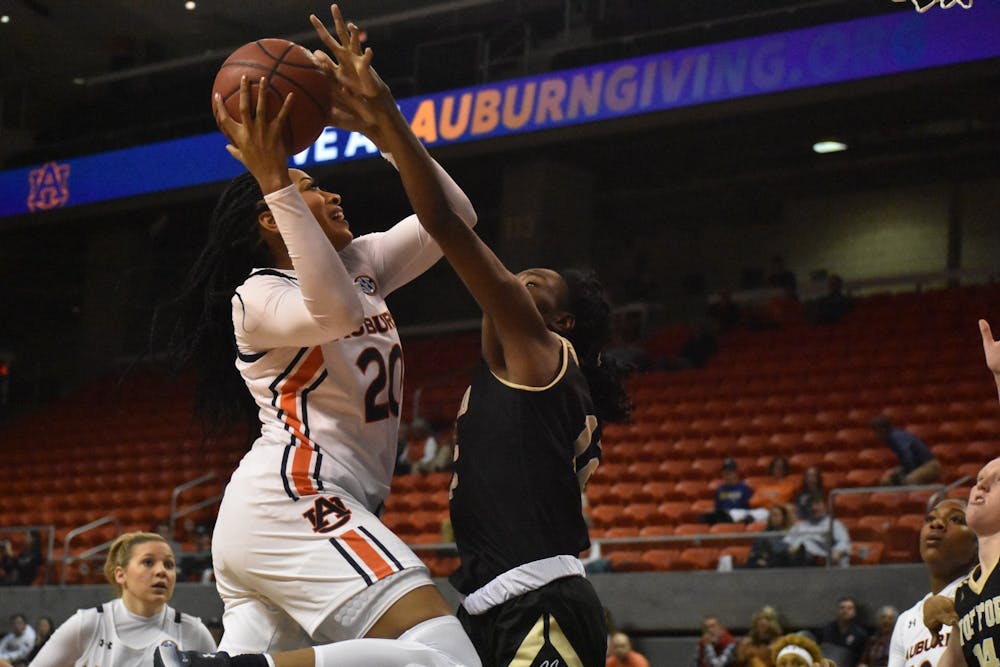 <p>Unique Thompson (20) fights through contact during Auburn women's basketball vs. Wofford on Nov. 6, 2019, in Auburn, Ala.</p>