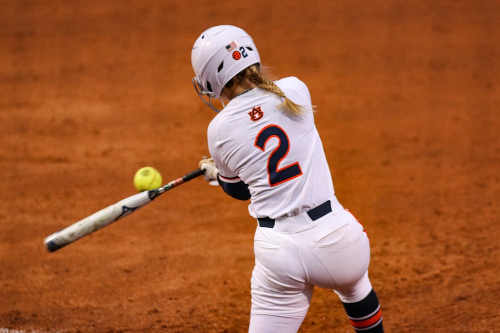 Sydney Cox (2) hits the ball during the game between Auburn and Kentucky at Jane B. Moore Field on April 16, 2021; Auburn, AL, USA. Photo via: Jacob Taylor/AU Athletics
