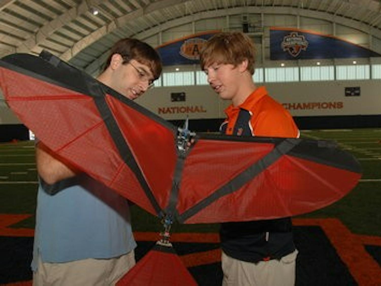 Brian Pappas (left) and Jarred Beck prepare to fly Robo-Nova in Auburn's new practice facility. (Jim Killiam / DIRECTOR OF ENGINEERING COMMUNICATIONS AND MARKETING)