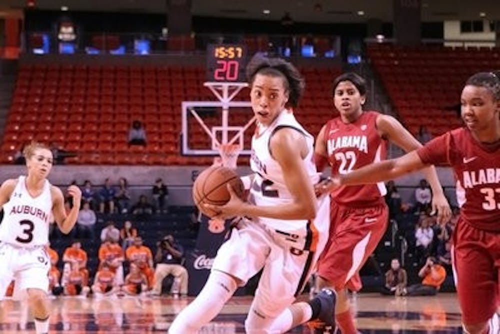 Sophomore guard/forward Tyrese Tanner drives to the basket in their win against Alabama. (Rebecca Croomes / PHOTO EDITOR)