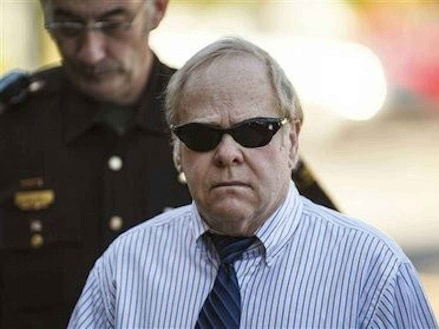 Harvey Updyke walking to the Lee County courthouse June 20. (Courtesy of Vasha Hunt, Opelika-Auburn News)
