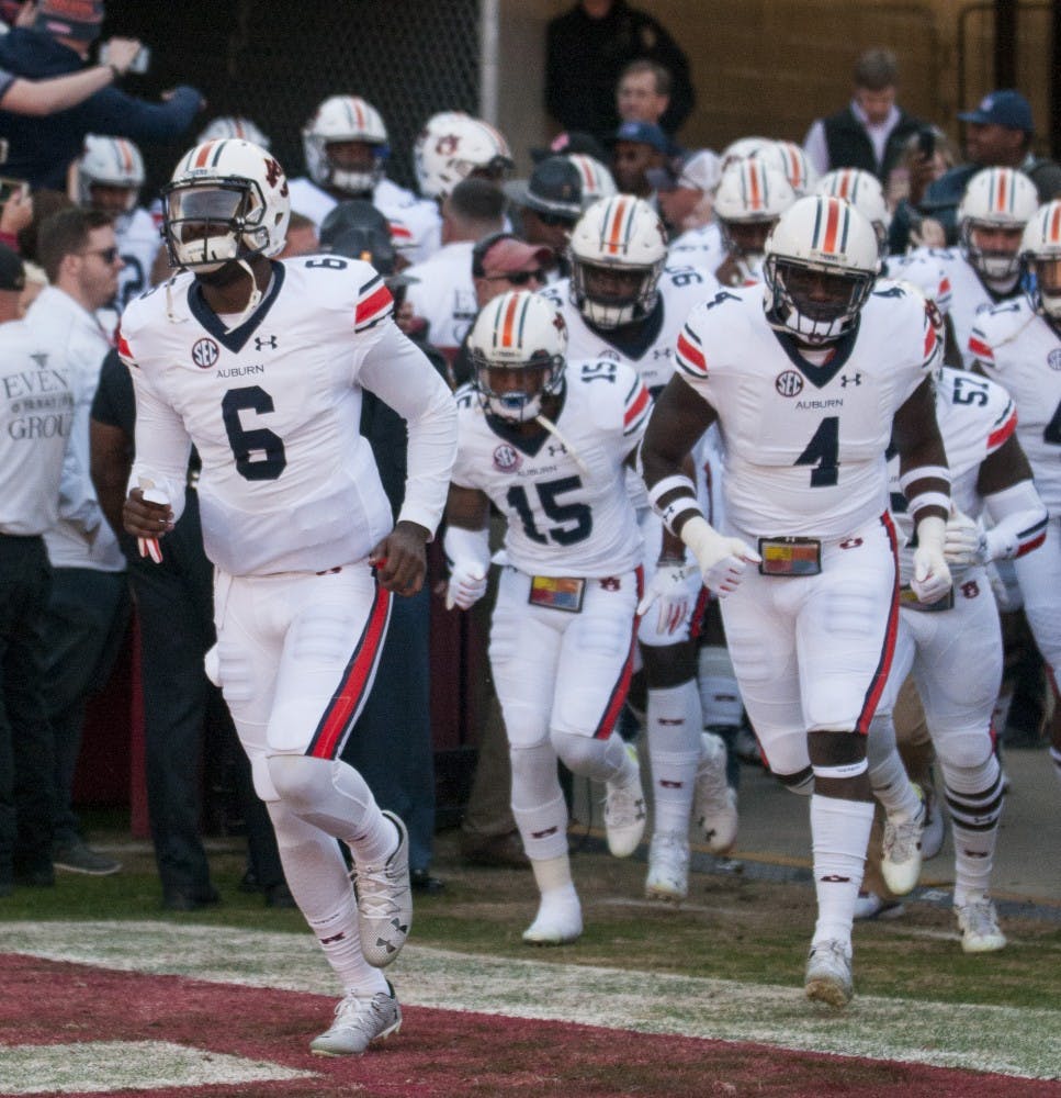 Quarterback Jeremy Johnson (6) leads the Auburn team onto the field pregame. Auburn vs Alabama on Saturday, Nov. 26 in Tuscaloosa, AL.