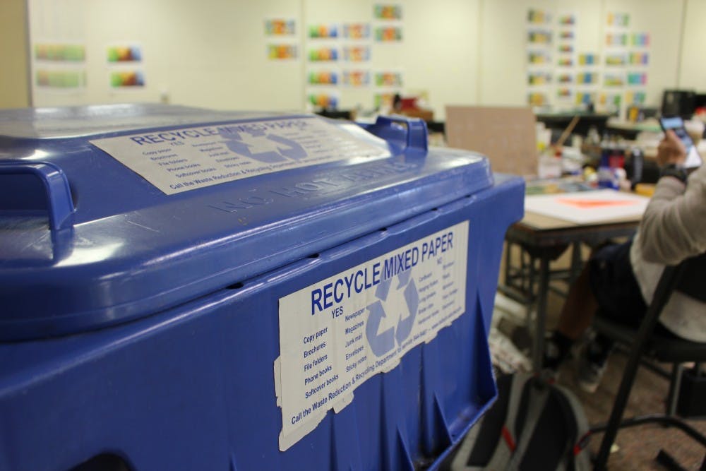 <p>Recycling bins line the studios of Wallace Hall and are one way to help live sustainably.</p>